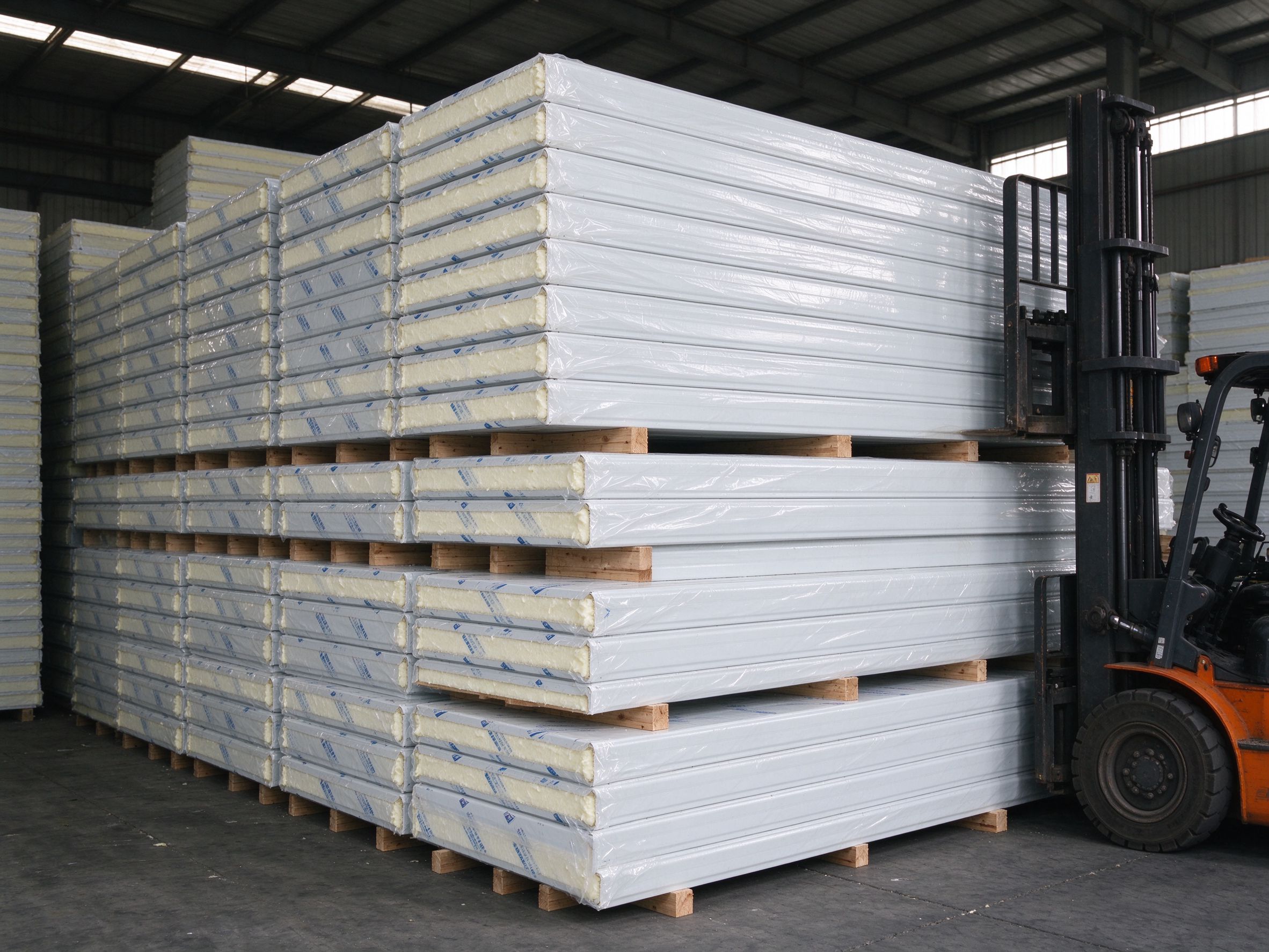 Insulated sandwich panels stacked for a cold store (illustrative concept image)