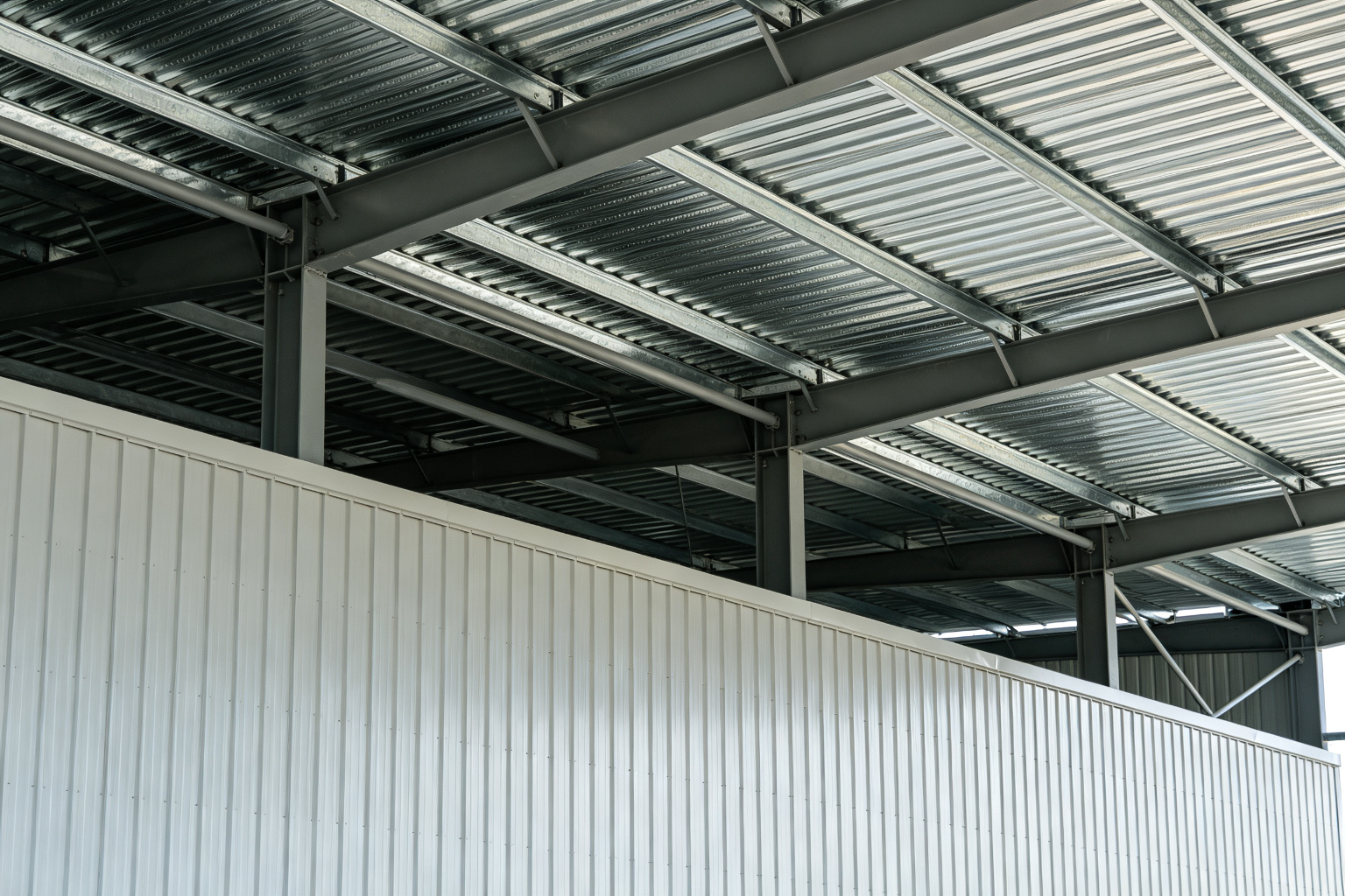 Steel roof and wall cladding panels installed on steel structure