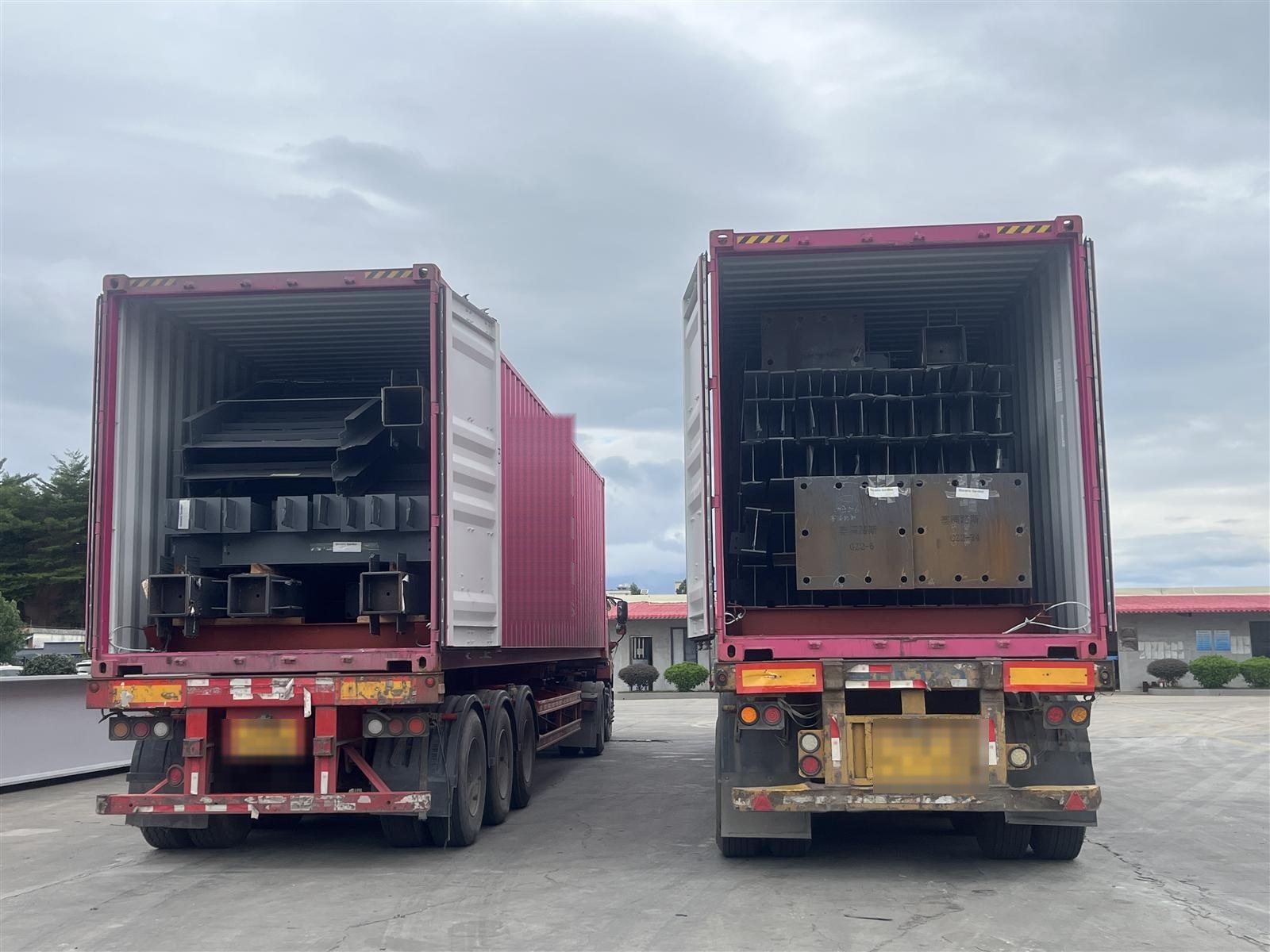 Loading large steel structure members into a container